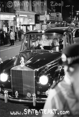 Queen Elizabeth II clearly viewed sitting in the back of the Royal Rolls Royce smiling at the crowd after leaving the Royal Variety Performance in the Dominion Theatre on Tottenham Court Road in the centre of London on Monday November 26, 2001. Prince Philip is sitting to the Queen’s left but is obscured by the frame of the car itself.